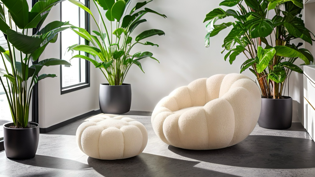 Cream boucle accent chair in a modern living room with soft natural lighting and designer home furniture.