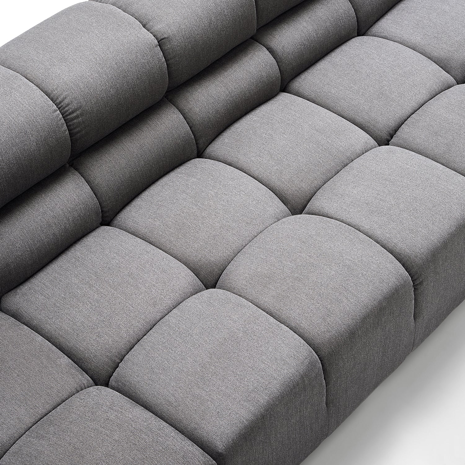 High-resolution close-up image of the gray Amora Sofa by Mario Capasa. This couch looks like if thick cubes were to form together to make a sectional.