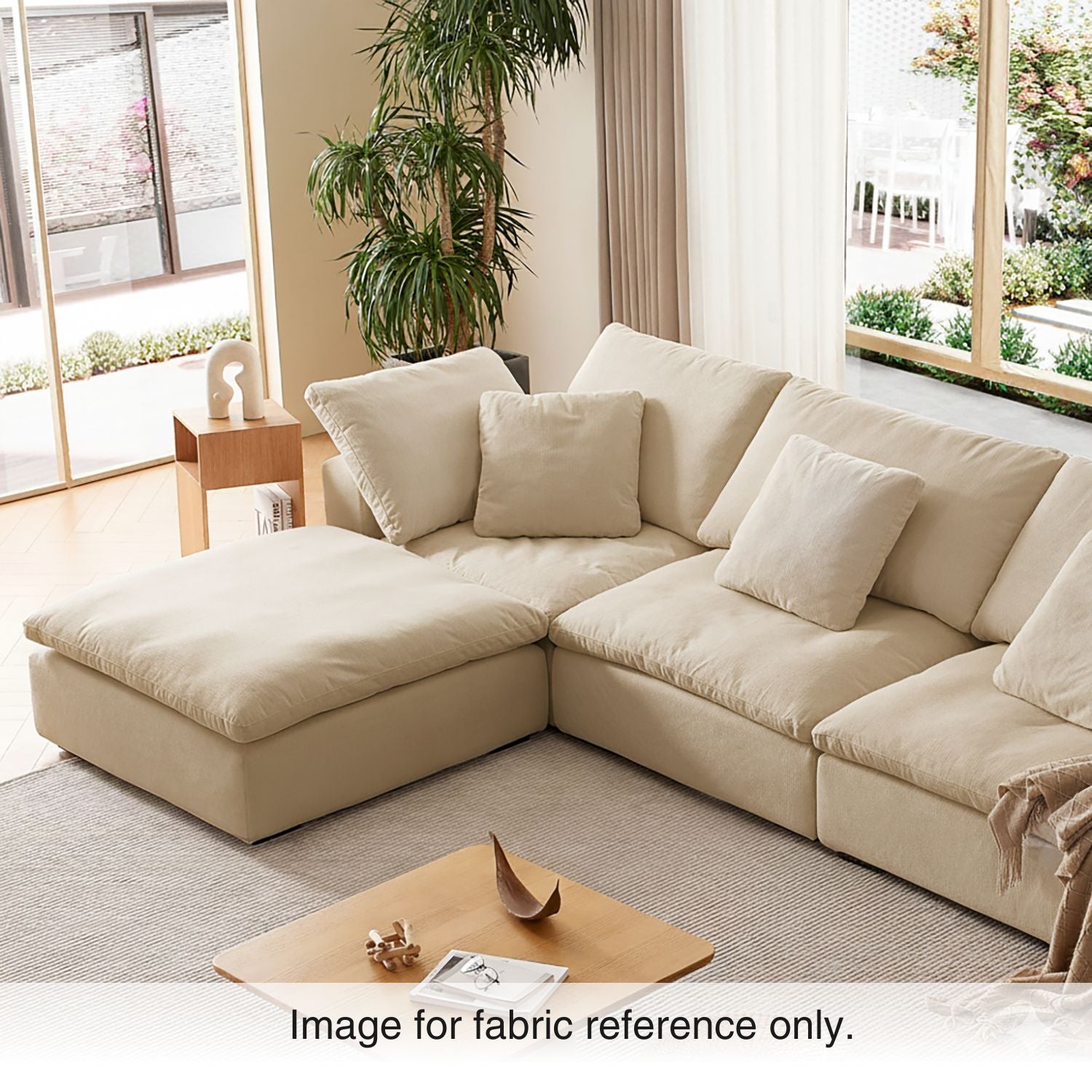 Beige velvet modular sectional sofa in a modern living room with soft natural light, featuring plush upholstery and neutral tones from the Tivoli Collection by Mario Capasa.