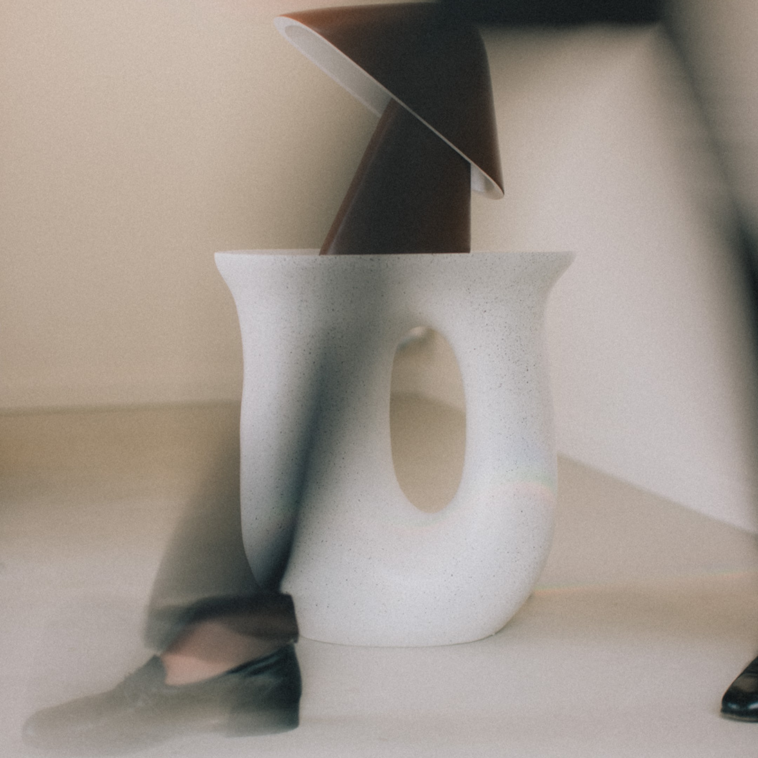 Mario Capasa in Los Angeles Furniture Store in front of ceramic coffee table