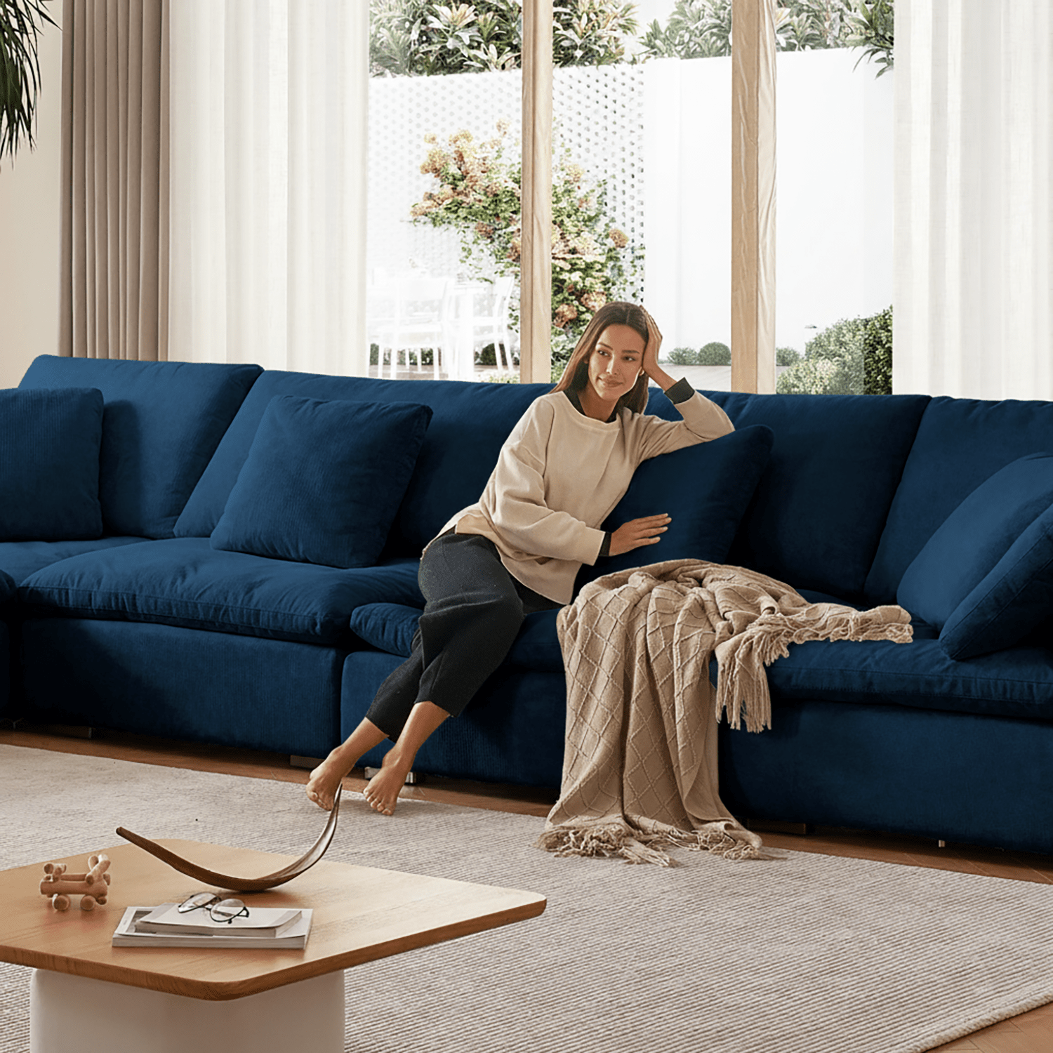 Stylish velvet loveseat in royal blue tone, complementing curated living room furniture.