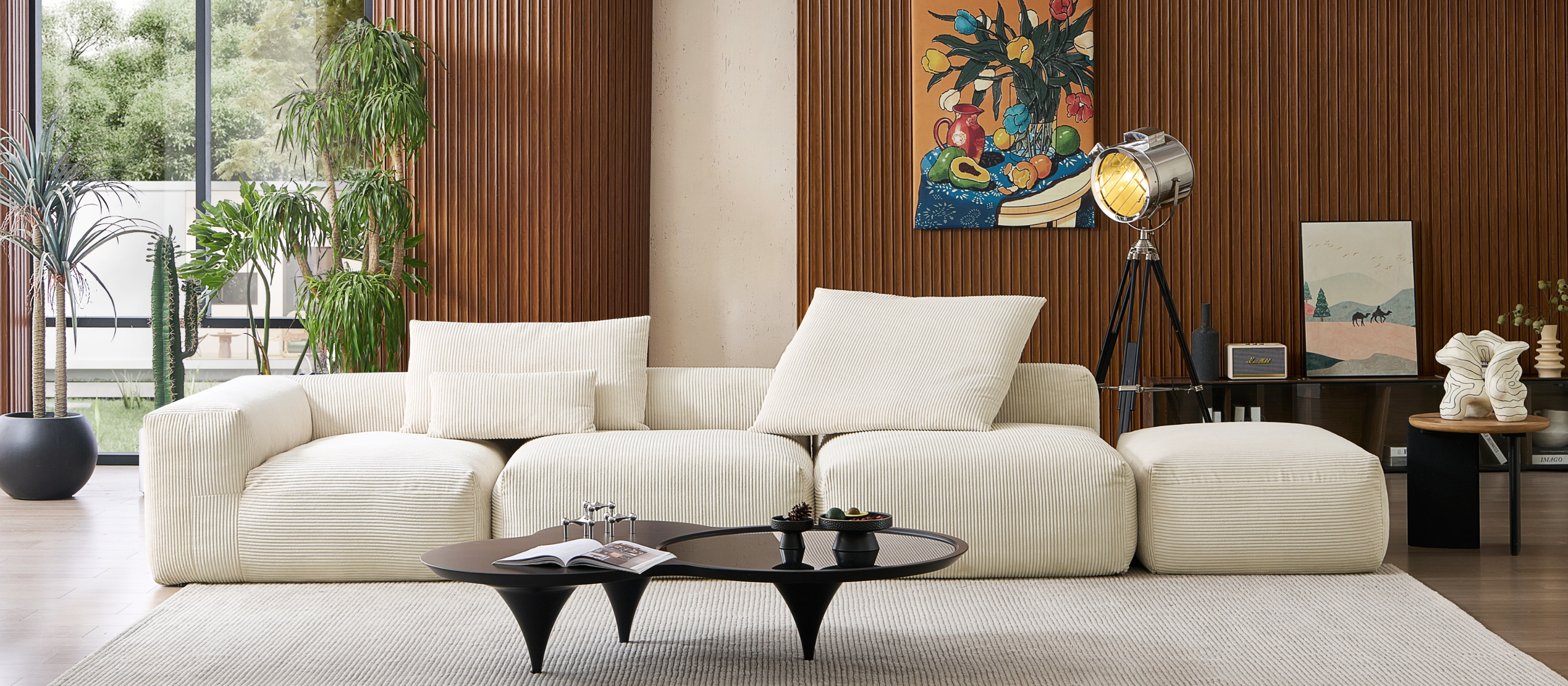 Luxury living room furniture including a modular couch system and space age coffee table by Mario Capasa, along with other home accessories.