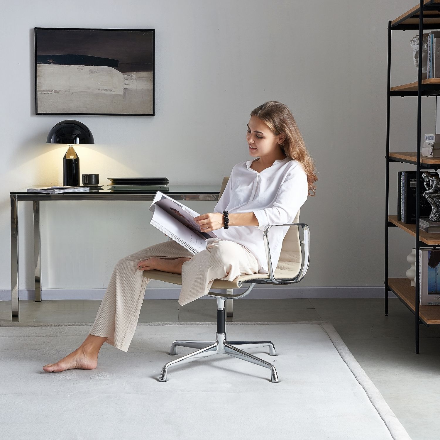 Modern office chair with chrome legs and neutral upholstery in a minimalist home furniture setup.