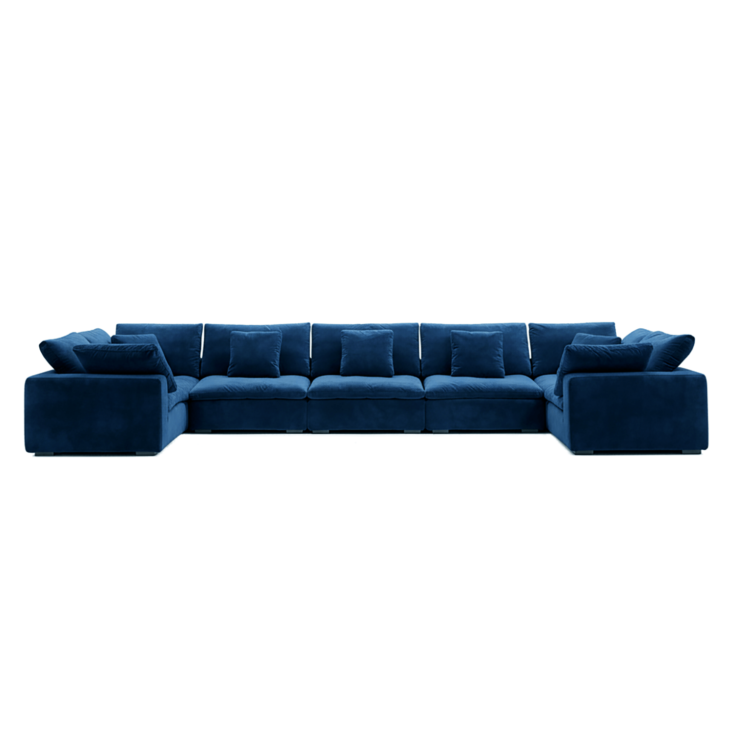 Sculptural blue velvet couch with deep cushions, featured in modern living room furniture.