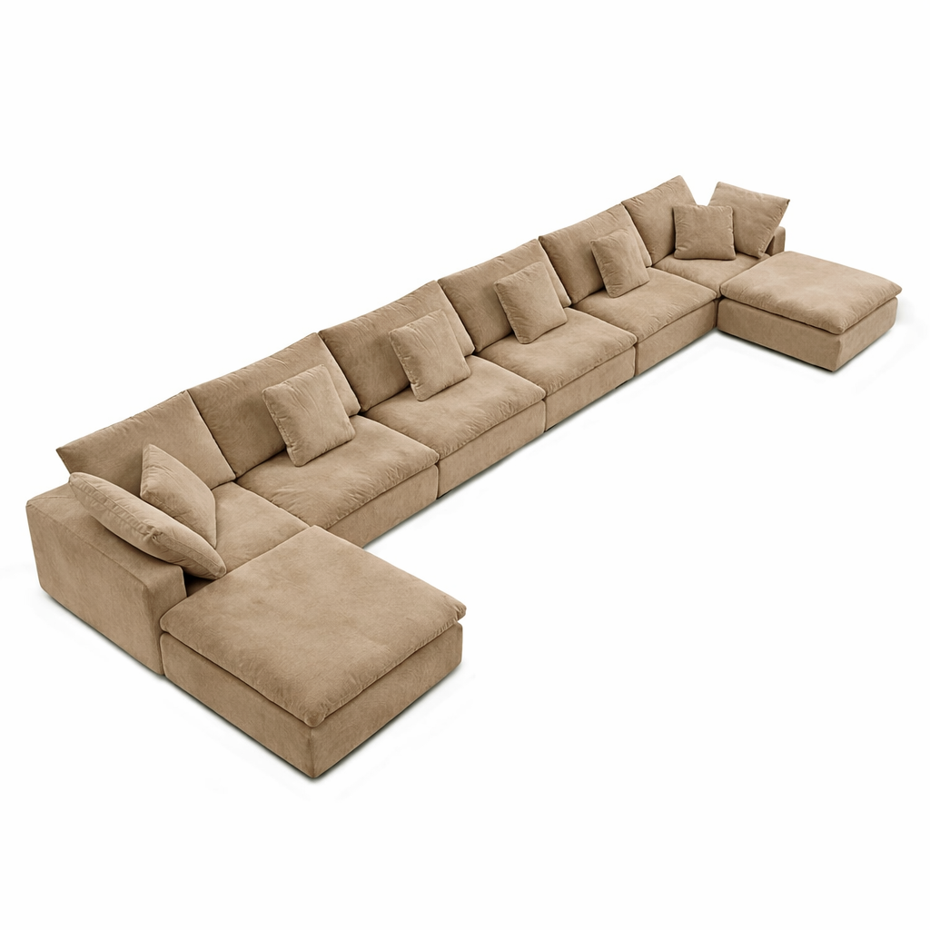 Modern brown velvet sectional sofa with oversized pillows, styled for home furniture collections.